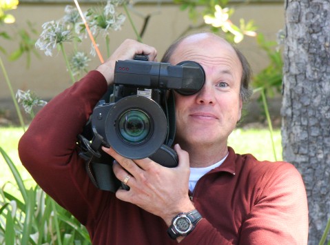 Bob McDonald holding a video camera